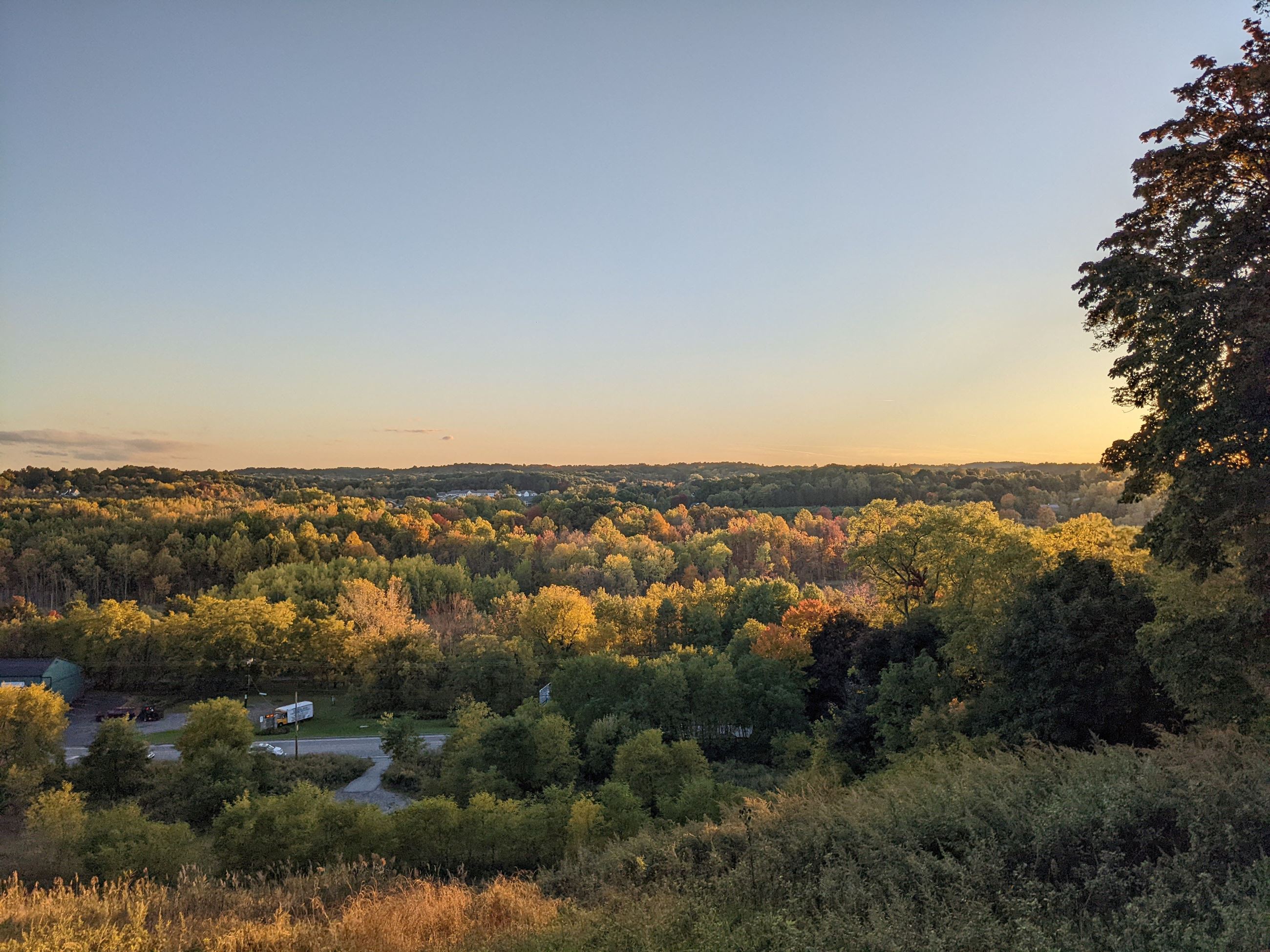 Kassandra Doyle, View from St. Patrick Cemetery, Victor NY, sun over trees