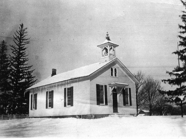 Boughton Hill School black and white photo of one story wooden structure with steeple for bell