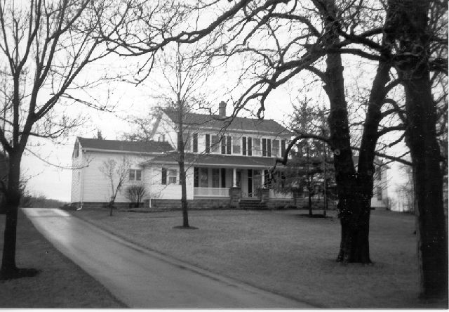 Boughton House modern black and white photo of two story structure with front porch